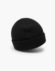Back view of the TravisMathew Cloud Beanie in black – minimalist rib-knit winter hat with smooth rounded crown, displayed on a clean white background