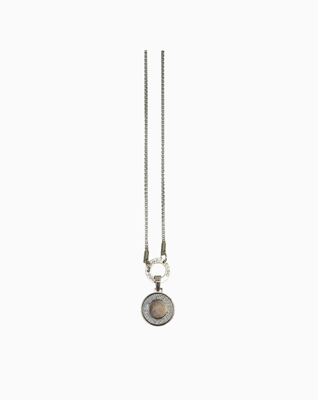 A sleek silver MXM Bling Necklace featuring a long chain and circular magnetic pendant attachment, displayed on a clean white background.