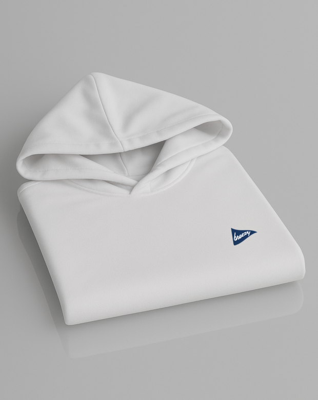 Breezy Golf white performance hoodie with blue logo, folded neatly on light grey background