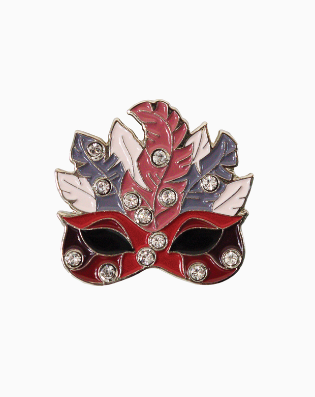 Red and silver masquerade-style golf ball marker adorned with Swarovski crystals, featuring a feathered mask design on a dark background.