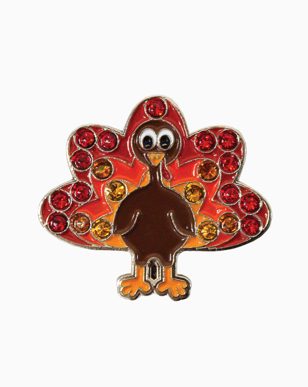 Turkey-shaped golf ball marker adorned with red, orange, and yellow Swarovski crystals, designed to attach to a hat clip.