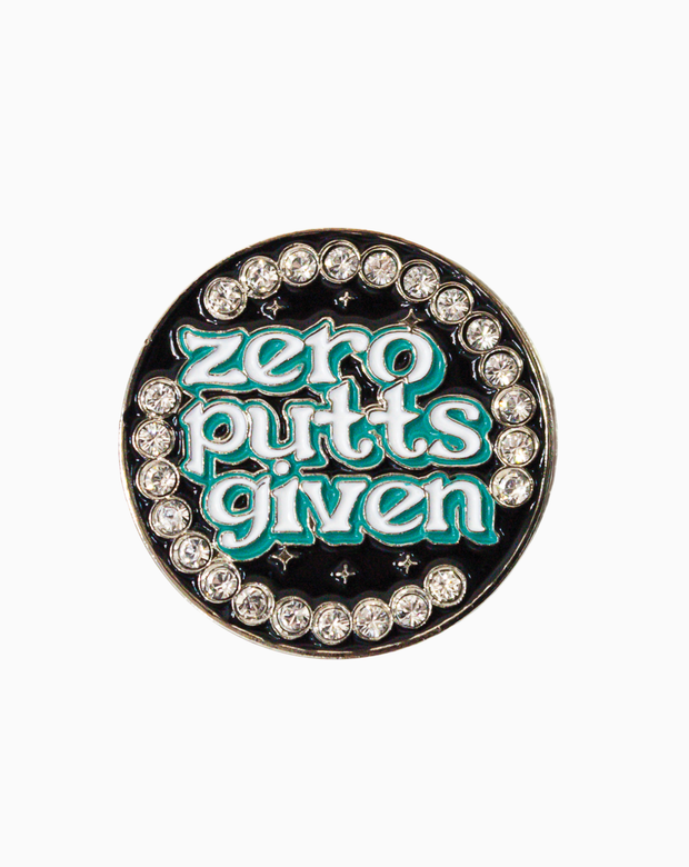 Round golf ball marker featuring the text 'Zero Putts Given' in teal lettering, surrounded by sparkling Swarovski crystals on a glossy black background.